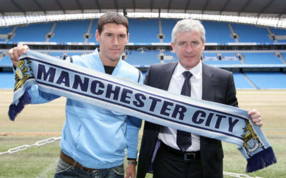 Gareth Barry and Mark Hughes - Manchester City (PA)