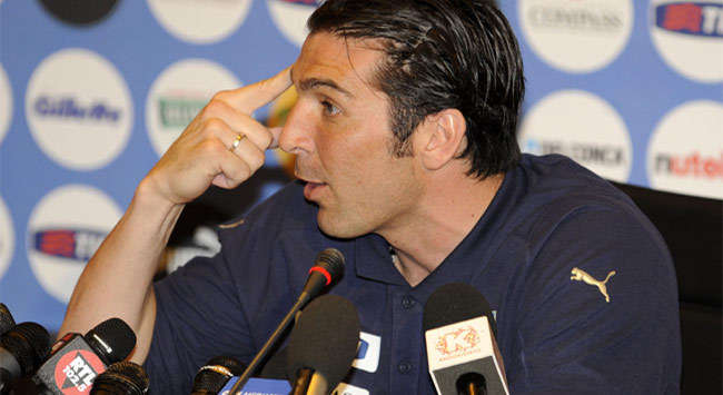 Italy goalkeeper Gianluigi Buffon tries to explain what happened after Italy's 1-0 defeat to Egypt