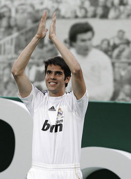 Real Madrid's €67.5million signing Kaka waves to the 50,000 strong crowd during his unveiling at the Bernabeu