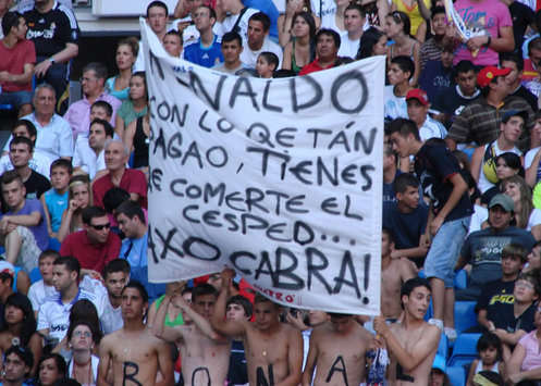 Real Madrid fans hoist aloft a banner to grab the attention of Cristiano Ronaldo (Goal.com)