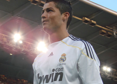 Real Madrid's €94million signing Cristiano Ronaldo walks out of the Bernabeu tunnel to be met by 80,000 fans