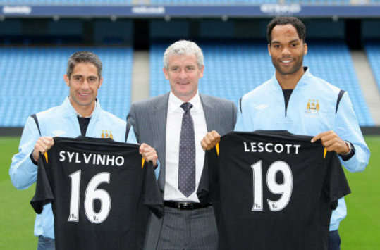 Joleon Lescott & Sylvinho - Manchester City (PA)