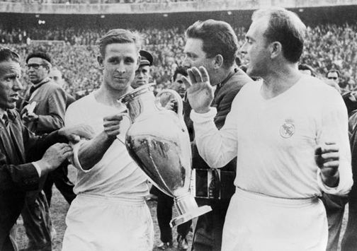Raymond Kopa and teammate Alfredo Di Stefano pose after Real Madrid's victory over Fiorentina in 1957 - the second successive year the Spanish giants won the competition. Los Blancos would go on to win the competition a record five times in succession