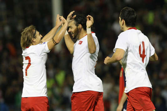 Turkey's Servet Cetin celebrates his score against Armenia with his teammates (tff.org)