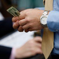 Money counting man (Getty Images)