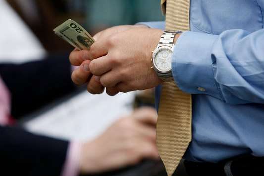 Money counting man (Getty Images)