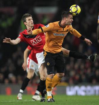 Stefen Maierhofer beats Carrick to the header. (Getty Images)