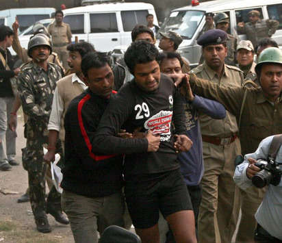 Churchill Arindam Bhattacharya being escorted by the police.