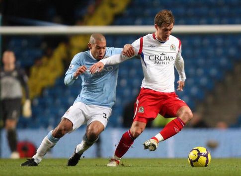 Nigel de Jong and Morten Gamst Pedersen locked in battle as Manchester City take on Blackburn Rovers. (Getty Images)