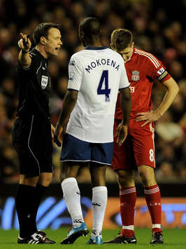Referee Stuart Attwell has words with Steven Gerrard of Liverpool following his challenge on Michael Brown of Portsmouth during the Barclays Premier League match between Liverpool and Portsmouth (Geety Images)